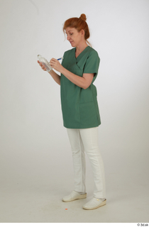 Photos Daya Jones Nurse in green Pose 2 preparing medication…